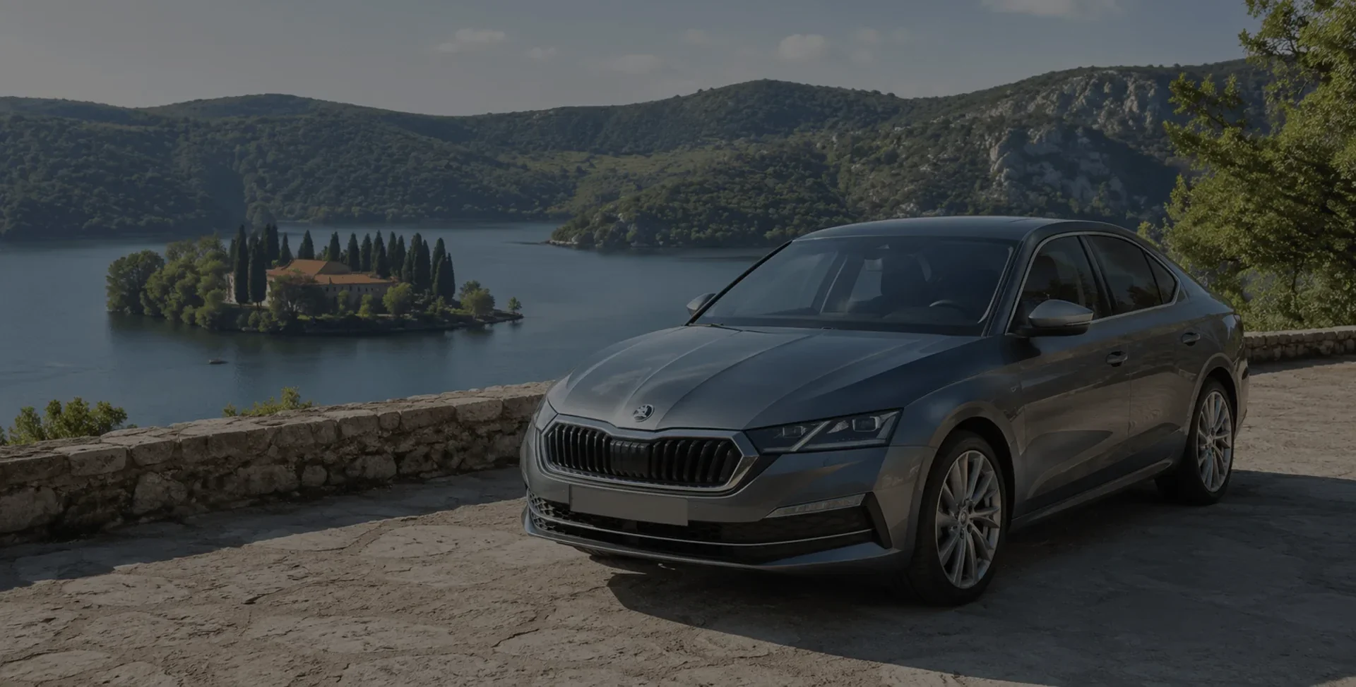 Škoda Octavia transfer vehicle above Krka National Park with the Visovac monastery island